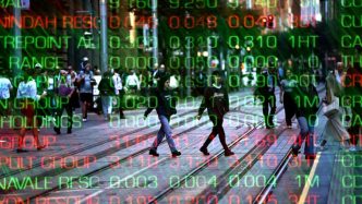Australian shares edge higher despite Wall St sell