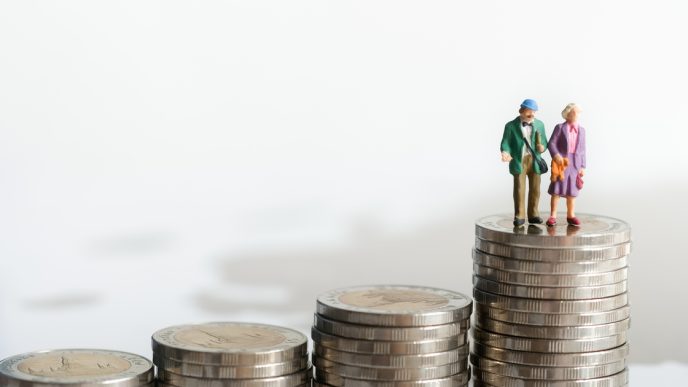 Figures of old man and woman on top of coins
