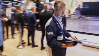 Wall St mixed in start to busy week for earnings,