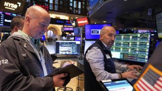 Wall St tumbles as Trump takes aim at Fed Chair