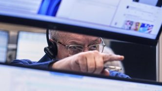 Wall Street ends whipsaw week higher