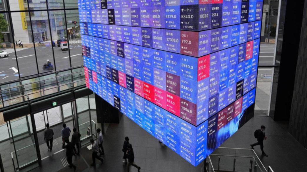 World stocks slide as Trump's Fed attacks jangle