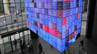 World stocks slide as Trump's Fed attacks jangle