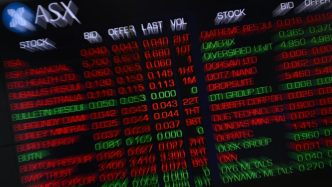 Australian shares beat jitters to finish month on