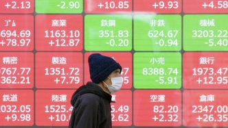 Shares inch higher as wary investors gauge tariff