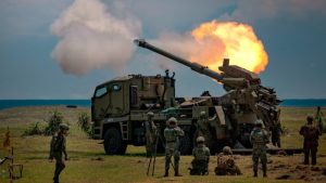 Philippine troops fire a howitzer during an exercise