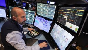 Wall Street opens flat, set to cap strong weekly