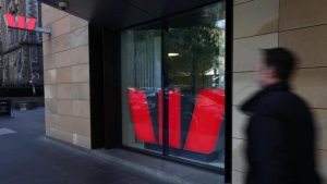 Westpac profit ticks lower, warns on global