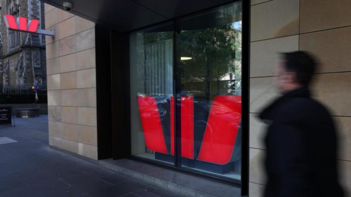 Westpac profit ticks lower, warns on global
