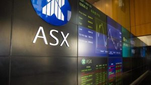ASX closes at a record high as trade talks