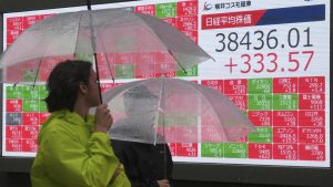Asian shares creep higher, US dollar languishes