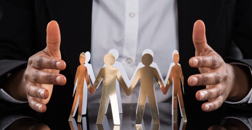 Hands either side of circle of family figures
