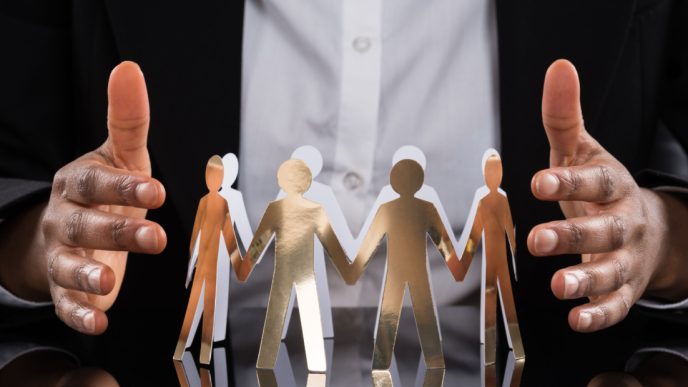 Hands either side of circle of family figures