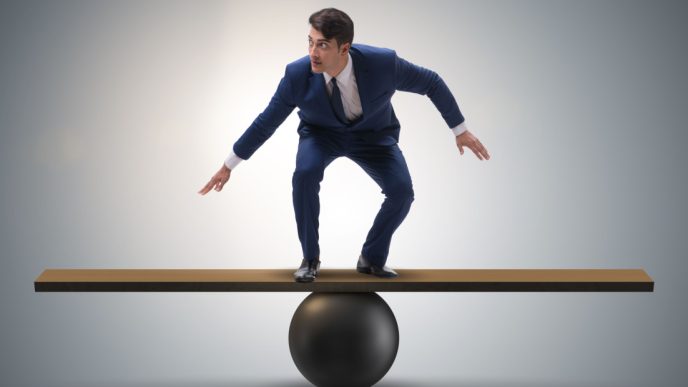 Man balances on see-saw