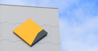 Commonwealth Bank logo on the side of a building