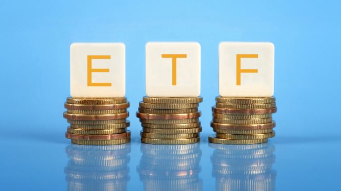ETF letters sitting on 3 stacks of coins