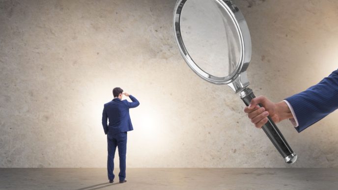 Man under magnifying glass