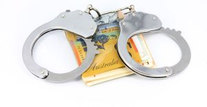 Handcuffs and banknotes