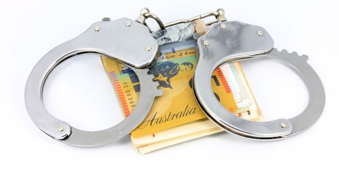 Handcuffs and banknotes